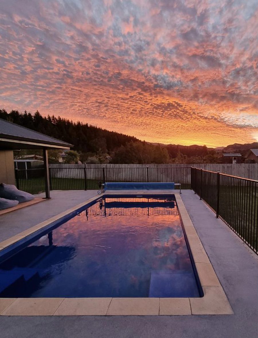 Bayside Cove pool finished and filled at sunset near Tauranga